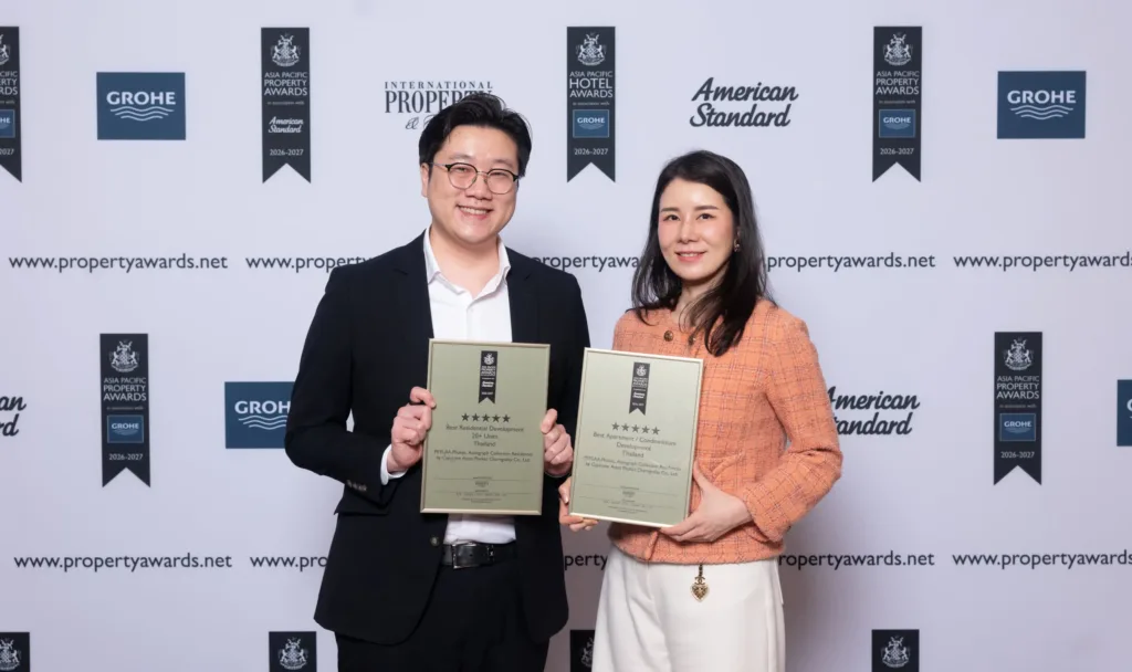 Capstone Asset executives holding two five-star Asia Pacific Property Awards 2026–2027 certificates for PEYLAA Phuket
